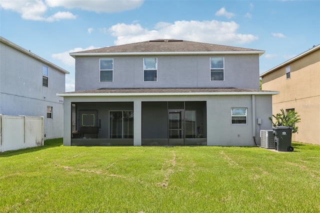 1811 Palm Warbler Ln, Ruskin, FL 33570 - rear view of property featuring a sunroom, stucco siding, and roof with shingles