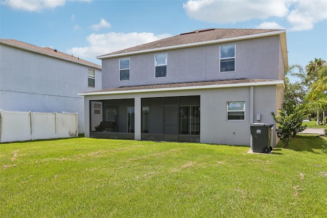 1811 Palm Warbler Ln, Ruskin, FL 33570 - back of property with a sunroom, stucco siding, and roof with shingles