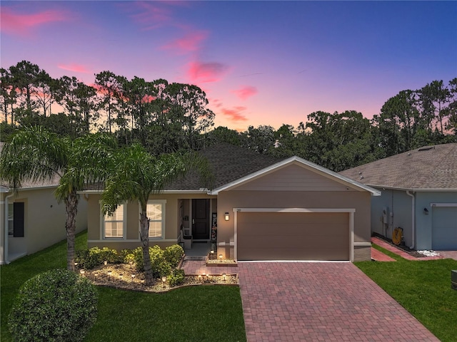 289 Siesta Vista Ct, Davenport, FL 33896 - ranch-style house with stucco siding, decorative driveway, and a yard