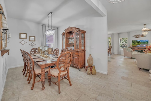 289 Siesta Vista Ct, Davenport, FL 33896 - dining space featuring light tile patterned floors and a chandelier