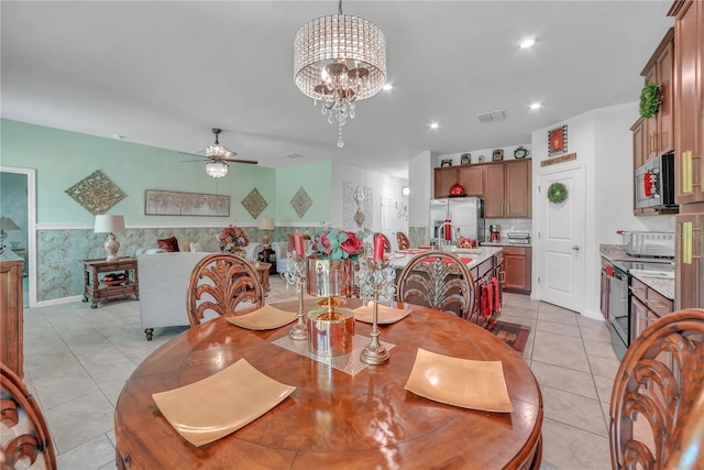 289 Siesta Vista Ct, Davenport, FL 33896 - dining area featuring a ceiling fan, light tile patterned floors, recessed lighting, and a chandelier