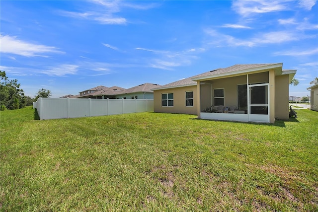289 Siesta Vista Ct, Davenport, FL 33896 - rear view of house featuring stucco siding and a sunroom