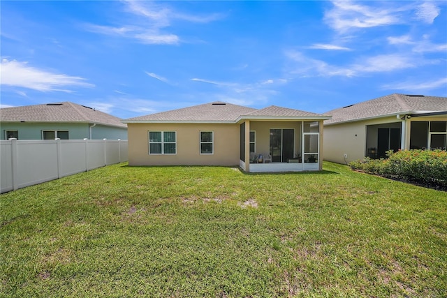 289 Siesta Vista Ct, Davenport, FL 33896 - rear view of property featuring a sunroom, stucco siding, and a shingled roof