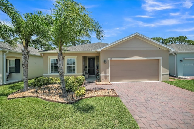 289 Siesta Vista Ct, Davenport, FL 33896 - single story home featuring stucco siding, decorative driveway, a garage, and a front yard