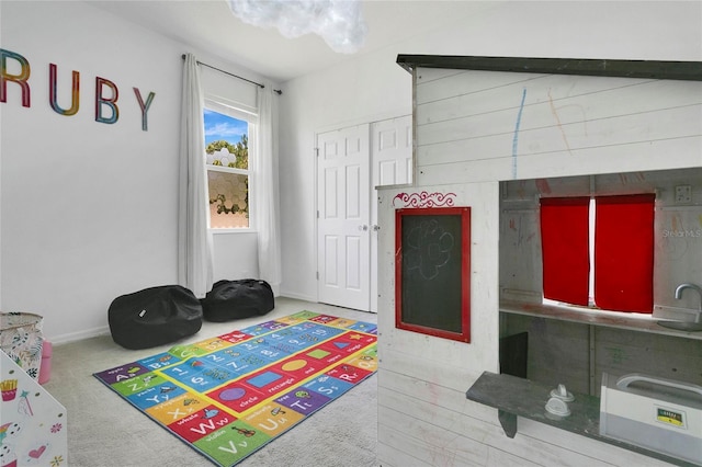 356 Irving Bend Dr, Groveland, FL 34736 - rec room featuring carpet floors and baseboards