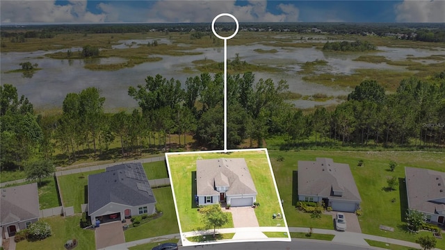 356 Irving Bend Dr, Groveland, FL 34736 - aerial perspective of suburban area featuring property boundaries highlighted and a nearby body of water