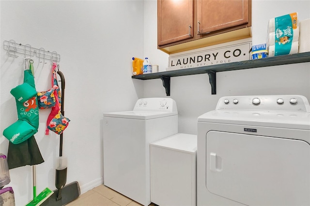 356 Irving Bend Dr, Groveland, FL 34736 - laundry room with separate washer and dryer, cabinet space, and light tile patterned floors
