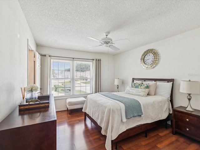 4220 Revere Cir, New Port Richey, FL 34653 - bedroom featuring wood finished floors, a textured ceiling, and ceiling fan