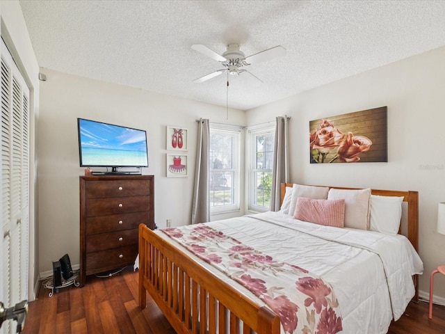 4220 Revere Cir, New Port Richey, FL 34653 - bedroom featuring wood finished floors, a textured ceiling, ceiling fan, and a closet