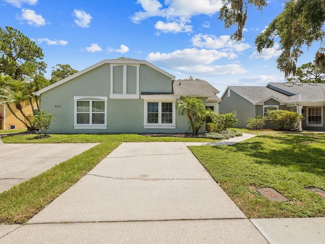 4220 Revere Cir, New Port Richey, FL 34653 - view of front of home with a front lawn and stucco siding