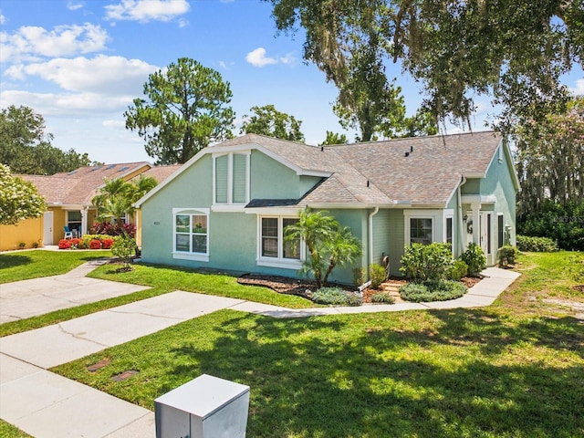 4220 Revere Cir, New Port Richey, FL 34653 - single story home featuring stucco siding, a front yard, and a shingled roof
