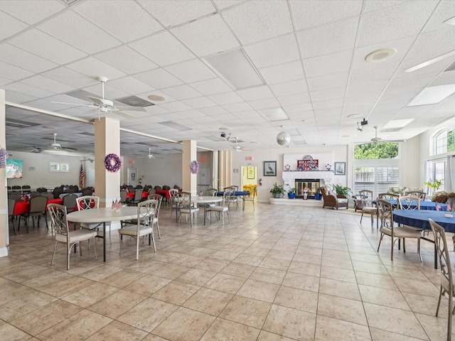 4220 Revere Cir, New Port Richey, FL 34653 - dining space featuring ceiling fan, light tile patterned flooring, and a drop ceiling