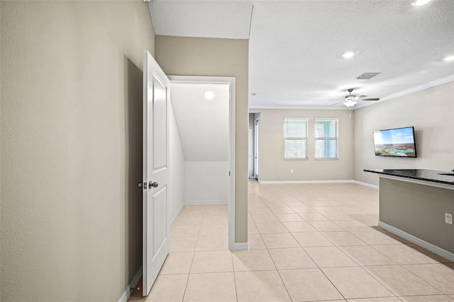 31945 Blue Passing Loop, Wesley Chapel, FL 33545 - unfurnished room featuring ceiling fan, light tile patterned floors, recessed lighting, a textured ceiling, and crown molding