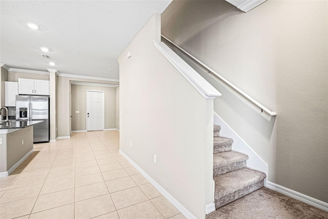 31945 Blue Passing Loop, Wesley Chapel, FL 33545 - staircase featuring crown molding, recessed lighting, and tile patterned flooring