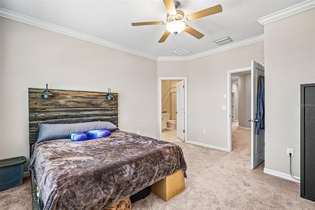 31945 Blue Passing Loop, Wesley Chapel, FL 33545 - bedroom with ornamental molding, light carpet, a textured ceiling, ceiling fan, and ensuite bath