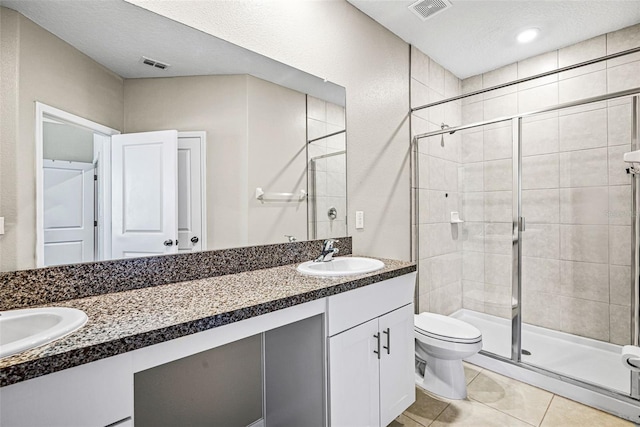 31945 Blue Passing Loop, Wesley Chapel, FL 33545 - bathroom with double vanity, a shower stall, and tile patterned flooring