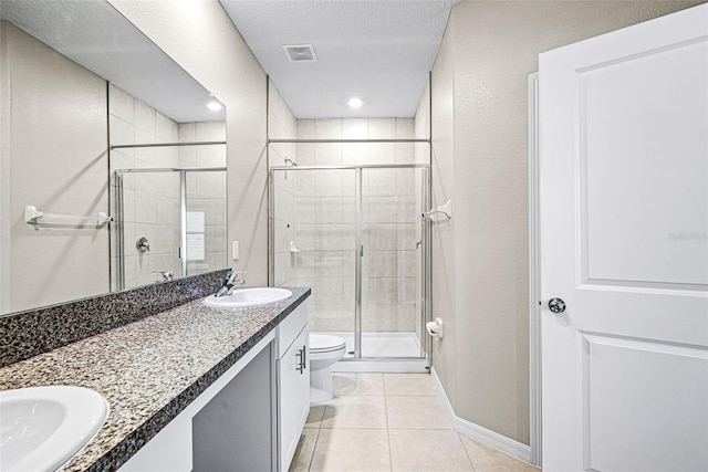 31945 Blue Passing Loop, Wesley Chapel, FL 33545 - bathroom with a stall shower, double vanity, and tile patterned floors