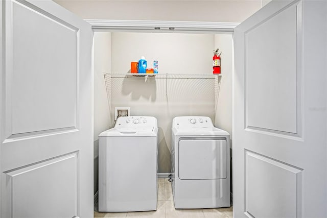 31945 Blue Passing Loop, Wesley Chapel, FL 33545 - laundry area featuring washer and clothes dryer and tile patterned flooring