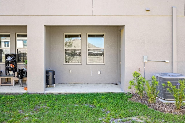 31945 Blue Passing Loop, Wesley Chapel, FL 33545 - entrance to property with a patio area and stucco siding