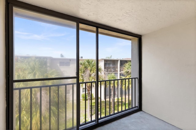 840 Virginia St Unit 301, Dunedin, FL 34698 - unfurnished sunroom featuring plenty of natural light