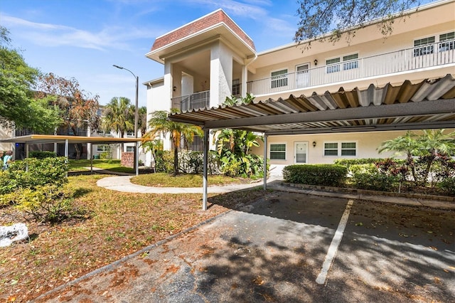 840 Virginia St Unit 301, Dunedin, FL 34698 - view of property featuring covered parking