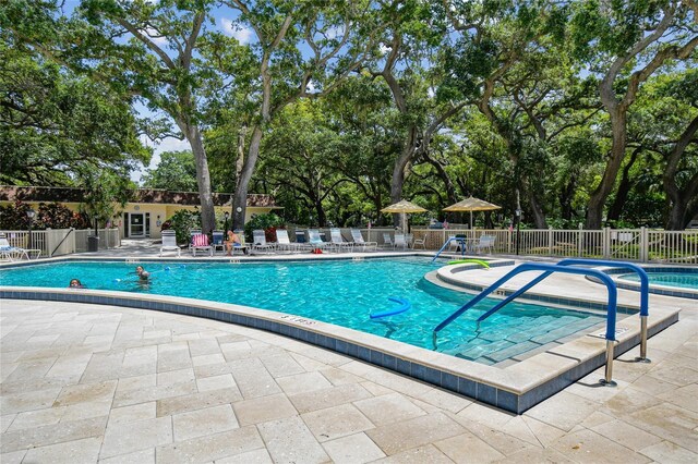 840 Virginia St Unit 301, Dunedin, FL 34698 - community pool with a patio and view of scattered trees