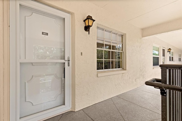 840 Virginia St Unit 301, Dunedin, FL 34698 - entrance to property featuring stucco siding