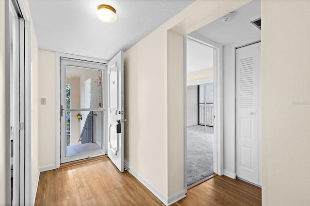 840 Virginia St Unit 301, Dunedin, FL 34698 - entryway with wood finished floors and baseboards