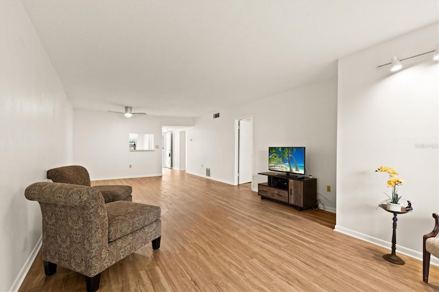 840 Virginia St Unit 301, Dunedin, FL 34698 - living room with light wood finished floors and a ceiling fan