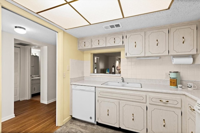 840 Virginia St Unit 301, Dunedin, FL 34698 - kitchen featuring dishwasher, decorative backsplash, and light countertops