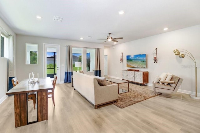 11809 Catawba Cv, Parrish, FL 34219 - living area featuring light wood-style flooring, plenty of natural light, ceiling fan, and recessed lighting