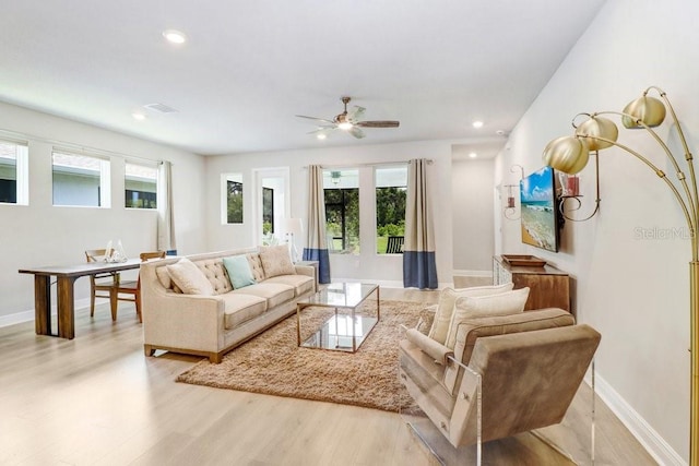 11809 Catawba Cv, Parrish, FL 34219 - living area featuring healthy amount of natural light, light wood finished floors, recessed lighting, and ceiling fan