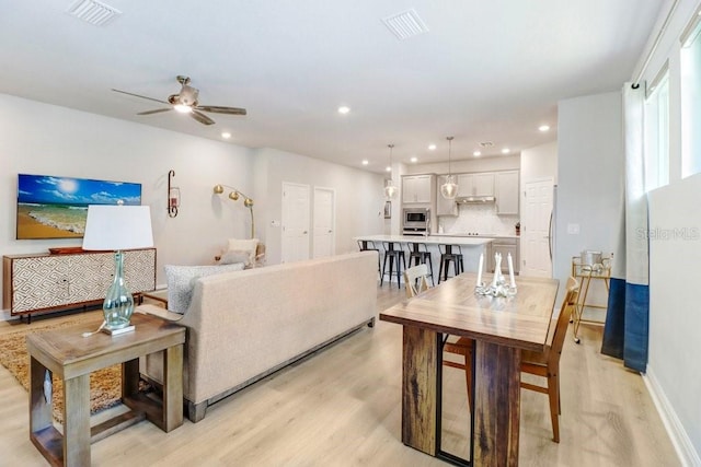 11809 Catawba Cv, Parrish, FL 34219 - living room with light wood-style flooring, recessed lighting, and ceiling fan