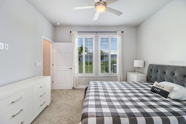 11809 Catawba Cv, Parrish, FL 34219 - bedroom with light carpet and a ceiling fan