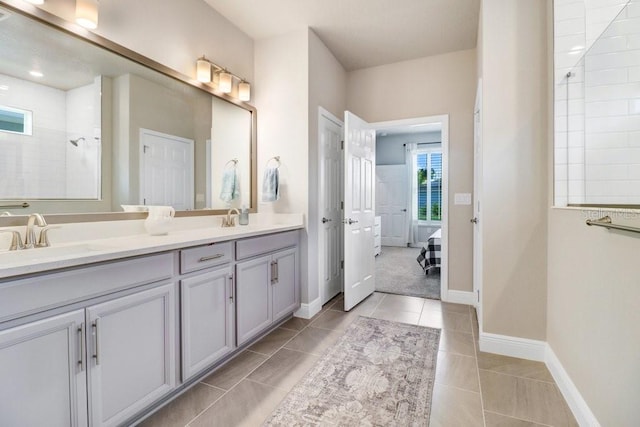 11809 Catawba Cv, Parrish, FL 34219 - bathroom with double vanity, tile patterned floors, and tiled shower