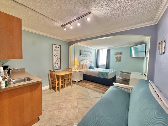 445 S Gulfview Blvd Unit 421, Clearwater Beach, FL 33767 - bedroom with arched walkways, crown molding, light tile patterned floors, a textured ceiling, and a wall unit AC
