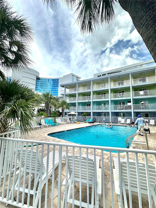 445 S Gulfview Blvd Unit 421, Clearwater Beach, FL 33767 - community pool with a patio area