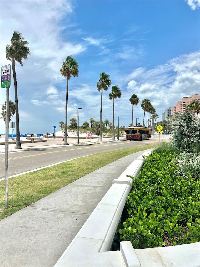 445 S Gulfview Blvd Unit 421, Clearwater Beach, FL 33767 - view of asphalt street featuring traffic signs, sidewalks, and street lighting