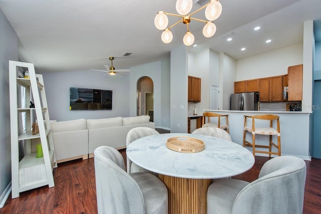 7001 Interbay Blvd Unit 121, Tampa, FL 33616 - dining room featuring arched walkways, recessed lighting, dark wood finished floors, ceiling fan, and high vaulted ceiling