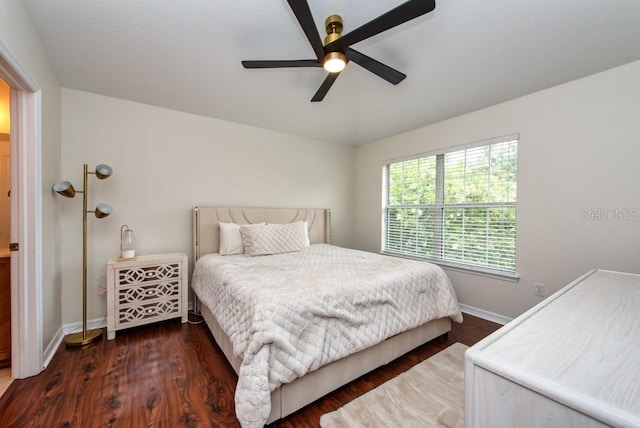 7001 Interbay Blvd Unit 121, Tampa, FL 33616 - bedroom with dark wood-style flooring and a ceiling fan