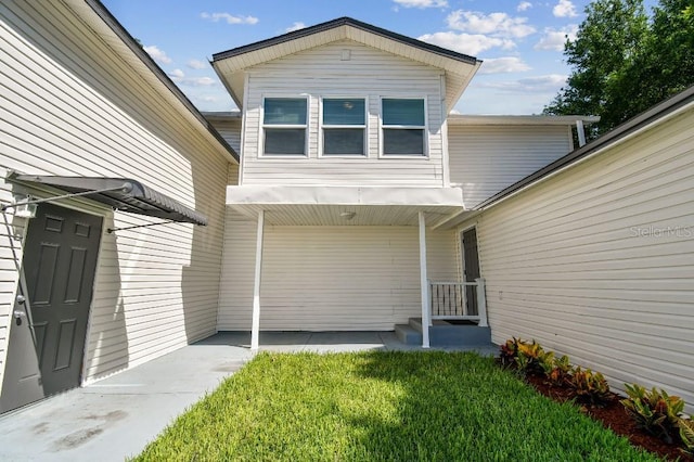 38323 11th Ave, Zephyrhills, FL 33542 - property entrance with a lawn
