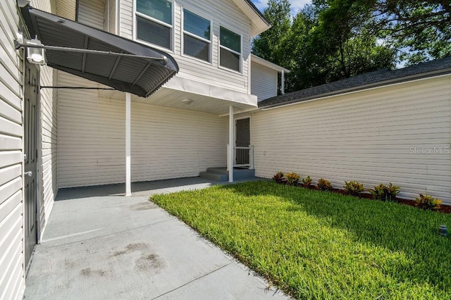 38323 11th Ave, Zephyrhills, FL 33542 - property entrance with a lawn