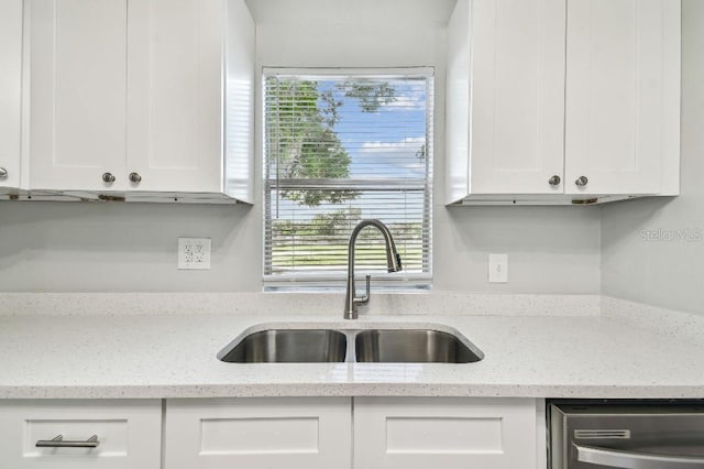 38323 11th Ave, Zephyrhills, FL 33542 - kitchen with dishwasher, white cabinets, and plenty of natural light
