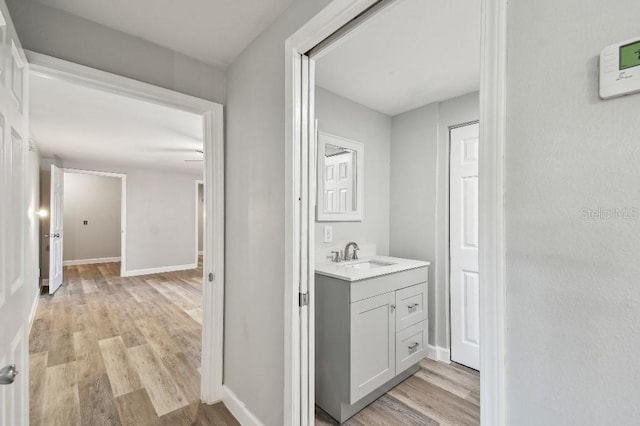 38323 11th Ave, Zephyrhills, FL 33542 - bathroom featuring wood finished floors and vanity