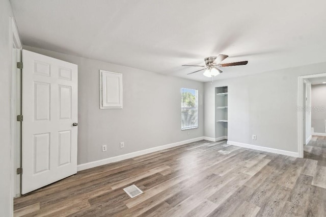 38323 11th Ave, Zephyrhills, FL 33542 - unfurnished room featuring a ceiling fan and wood finished floors