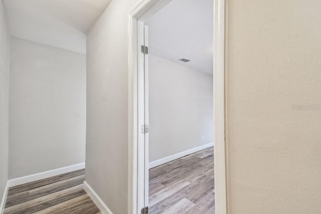 38323 11th Ave, Zephyrhills, FL 33542 - hallway featuring wood finished floors and baseboards