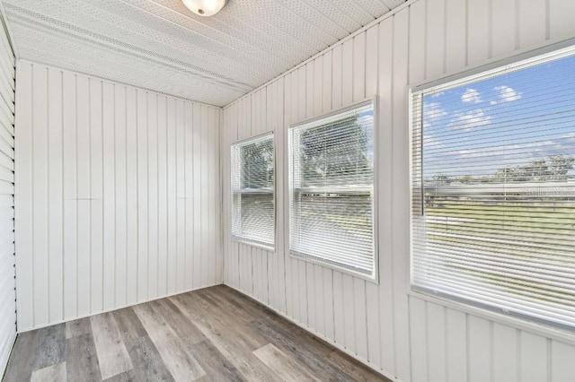 38323 11th Ave, Zephyrhills, FL 33542 - unfurnished sunroom with wood finished floors and wooden walls