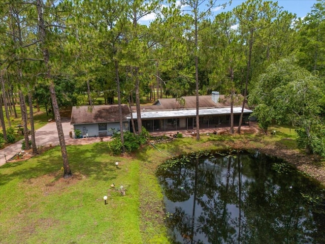 935 Ranch Rd, Tarpon Springs, FL 34688 - rear view of property featuring a lawn