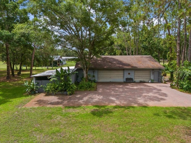 935 Ranch Rd, Tarpon Springs, FL 34688 - view of side of home featuring a yard and a detached garage