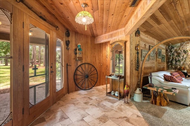 935 Ranch Rd, Tarpon Springs, FL 34688 - entryway featuring wooden ceiling, stone tile flooring, and wooden walls
